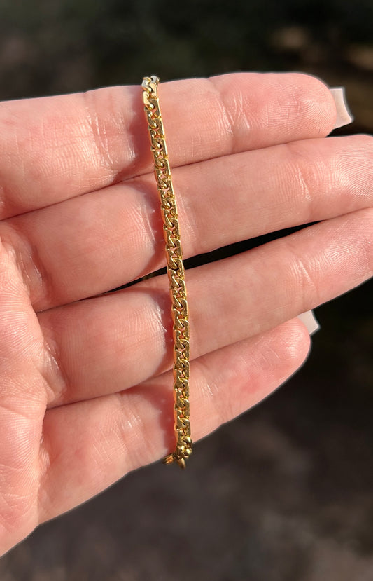 18k tight curb bracelet=7.5"