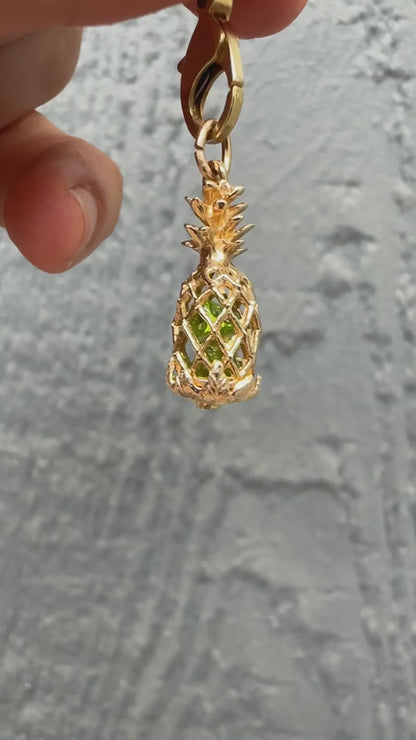 14k pineapple charm with peridot stones